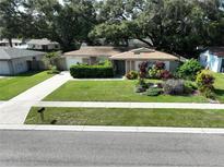 Single-story home with well-maintained landscaping and driveway at 2209 Whitney Pl, Valrico, FL 33594