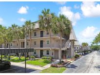Attractive two-story building with covered parking and landscaping at 8693 Bardmoor Blvd # 308B, Seminole, FL 33777