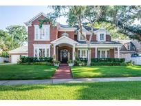 Beautiful two-story brick home with manicured lawn at 4517 W Dale Ave, Tampa, FL 33609