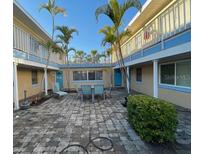 Community courtyard with seating and landscaping at 90 144Th Ave # 7, Madeira Beach, FL 33708