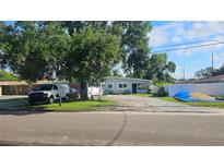 Cute ranch home with a spacious yard and driveway at 2905 W Osborne Ave, Tampa, FL 33614