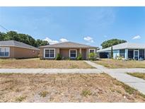 Single story home with a well-maintained lawn at 1203 Casa Bonita Ave, Ruskin, FL 33570