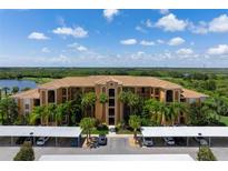 Luxury condo building with parking and water views at 8403 Grand Estuary Trl # 106, Bradenton, FL 34212