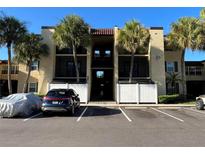 Two-story building with parking and tropical landscaping at 5306 Santa Rosa Ct # 342, Tampa, FL 33609