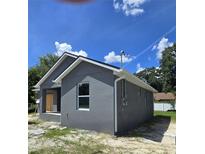 Gray house exterior with white trim, new construction at 710 E Alabama St, Plant City, FL 33563