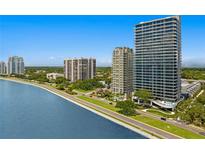Aerial view of waterfront high-rise condos with lush landscaping at 2912 W Santiago St # 1703, Tampa, FL 33629