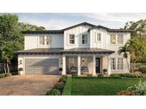 Two-story farmhouse with gray garage and landscaping at 3416 W Barcelona St, Tampa, FL 33629