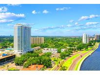 Aerial view of a luxury highrise building and surrounding area at 2910 W Barcelona St # 802, Tampa, FL 33629