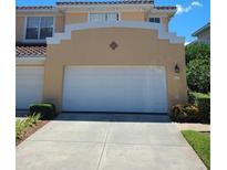 Townhouse exterior with a double-car garage at 277 Valencia Cir, St Petersburg, FL 33716