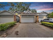 Townhouse exterior with driveway and landscaping at 1722 Castle Rock Rd, Tampa, FL 33612