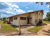 Single-Gathering home with attached garage and fenced yard at 4904 N Habana Ave, Tampa, FL 33614