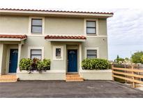 Two-story building with a shared parking area and lush landscaping at 6504 Abaco Dr # 101, Apollo Beach, FL 33572