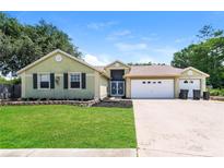 Charming single-Gathering home with a two-car garage at 18940 Emerald Ridge Dr, Hudson, FL 34667