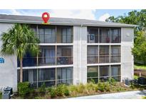 Condo building with screened balconies at 7508 Stillridge Dr # J, Tampa, FL 33615