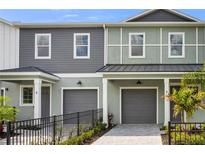 Charming two-story townhomes with individual garages and well-manicured landscaping at 5530 N 9Th St # 5, Tampa, FL 33604