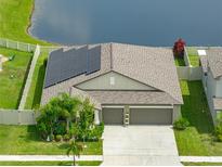 Single-Gathering home with solar panels and lake view at 5474 Leslie Canyon Dr, Wimauma, FL 33598