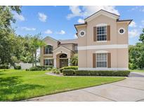 Two-story house with a large yard and driveway at 212 Excalibur Ct, Brandon, FL 33511