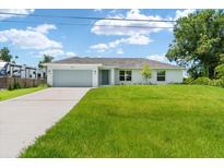 Newly built home with spacious lawn and driveway at 10317 Gulfstream Blvd, Englewood, FL 34224