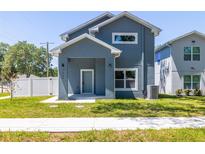 Charming two-story home featuring a modern design and well-maintained lawn at 7422 S 34Th Ave, Tampa, FL 33619