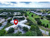 Aerial view of an apartment building near a golf course at 2285 Israeli Dr # 29, Clearwater, FL 33763