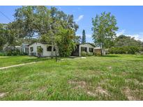 House exterior showcasing a renovated home with landscaping and yard at 5202 23Rd S Ave, Gulfport, FL 33707