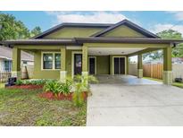 Charming craftsman style home with covered carport at 7110 N Taliaferro Ave, Tampa, FL 33604