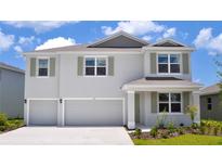 Charming two-story home features a three-car garage, manicured landscaping, and inviting curb appeal at 908 160Th E Ln, Bradenton, FL 34212