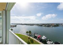 Stunning panoramic view of waterfront with boats and cityscape at 400 64Th Ave # 704, St Pete Beach, FL 33706