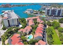 Aerial view of community, showing building arrangement and waterfront access at 240 Windward Psge # 605, Clearwater Beach, FL 33767