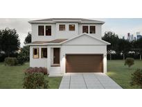 Two-story house with brown garage door and landscaping at Lot 96 Bird St., Tampa, FL 33604