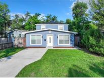 Charming two-story home boasts a well-manicured lawn and freshly painted exterior at 3128 17Th N St, St Petersburg, FL 33713