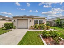 Single-story house with attached garage and landscaping at 6108 Lanshire Dr, Tampa, FL 33634