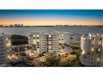 Aerial view of luxury condo building at sunset at 2 Seaside Ln # 802, Belleair, FL 33756