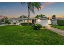 Charming single story home with well manicured lawn at 7015 Flaggler Dr, Port Richey, FL 34668