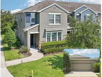 Charming two-story home featuring a well-manicured lawn and attached garage at 6357 Shore Vista Pl, Apollo Beach, FL 33572