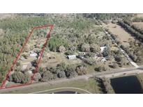 Aerial view of property showing a house and large lot of land at 30737 Elam Rd, Wesley Chapel, FL 33545