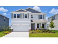 Charming two-story home with a manicured lawn and a two-car garage. Beautiful landscaping at 16029 7Th E Ave, Bradenton, FL 34212
