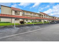 Covered parking with plenty of spaces at 2440 Winding Creek Blvd # 201, Clearwater, FL 33761