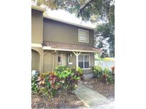 Attractive two-story townhome with landscaping and walkway at 7634 Cortez Ct, Tampa, FL 33615