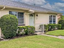 Well-maintained house exterior with manicured lawn at 306 Friar Ct # B, Sun City Center, FL 33573