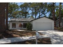 Charming single Gathering home featuring a two-car garage and freshly painted exterior at 1503 N Conrad Ave, Sarasota, FL 34237