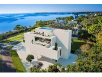 Luxury waterfront home with rooftop pool and stunning water views at 100 Shore Dr, Tarpon Springs, FL 34689