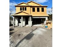Two-story house under construction, featuring a modern design and large windows at 815 W Braddock St, Tampa, FL 33603