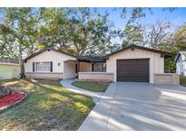 Charming ranch home with updated exterior and landscaping at 12613 Blackberry Row, Hudson, FL 34667