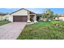 Cozy one-story house with attached garage at 7022 Arbor View Ln, New Port Richey, FL 34653