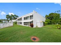 White two-story home with lush lawn at 1655 S Highland Ave # E223, Clearwater, FL 33756