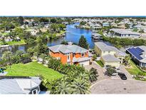 Aerial view of a waterfront house with canal access at 404 Bahama Grande Blvd, Apollo Beach, FL 33572