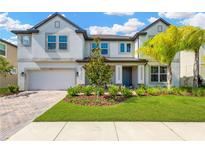 Two story home with landscaped yard and paver driveway at 19336 Eagle Creek Ln, Tampa, FL 33647