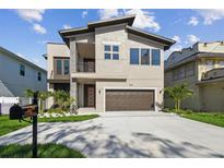 Contemporary two-story home featuring a two-car garage and modern architectural details at 2206 N Boulevard, Tampa, FL 33602