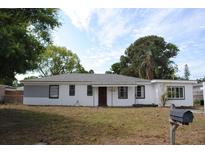Charming single-story home featuring a freshly painted exterior, well-maintained lawn, and clear address display at 3908 W Wallace Ave, Tampa, FL 33611
